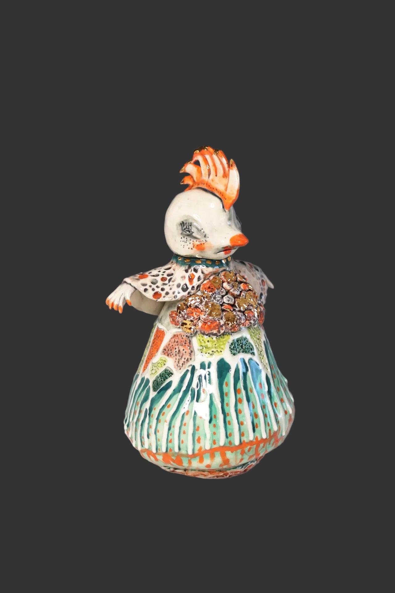 Colorful ceramic figure on a gray background