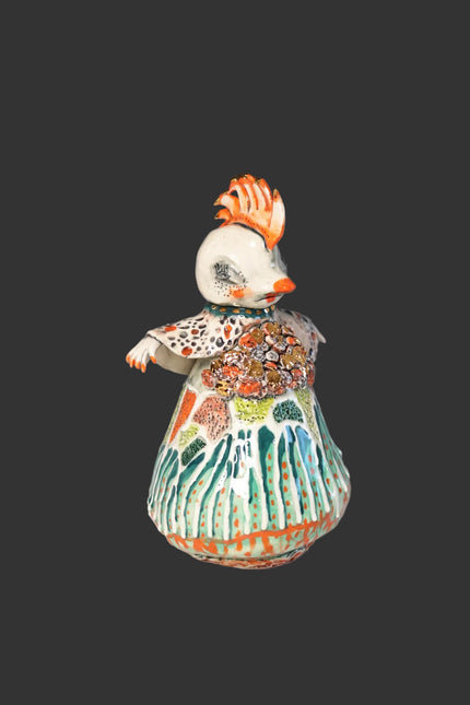 Colorful ceramic figure on a gray background